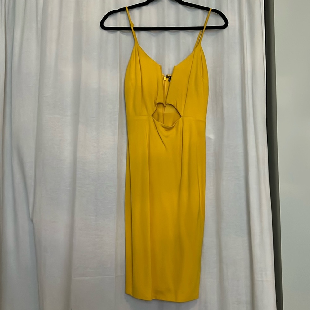 Yellow body-con dress with front cutout. NWT